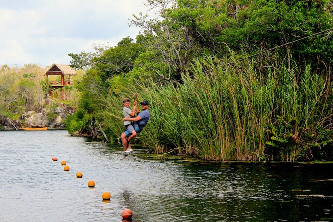 4 Private Cenotes, Zip-Lines, Canoes & Mayan Village with Delicious Lunch - Zip-lines, canoes, and cliff jumps at Tankah