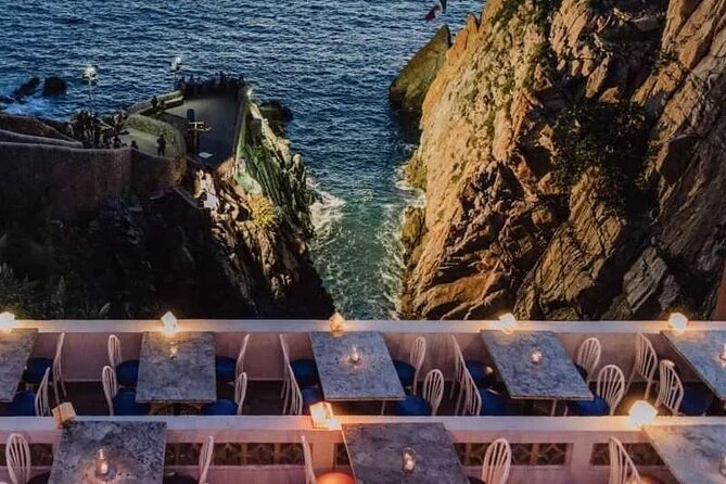 Acapulco Cliff Divers at Night - The performers climb, pray, and wait