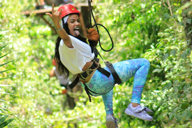 Amazing ATV Tour, Ziplines and Cenote Swim with Lunch and round trip included - Ziplining above the trees