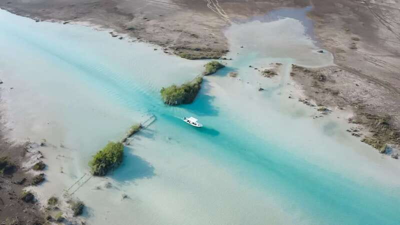 Bacalar: 3 Hour Boat Trip with Swimming & Drinks - Cenote Esmeralda shows the lagoon’s hidden depth