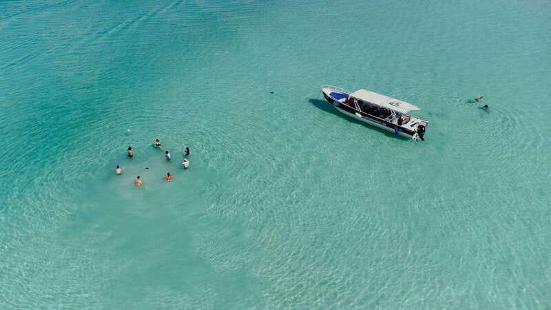 Bacalar Lagoon Sightseeing Boat Tour with Open Bar & Snack - Three cenotes, three different stops