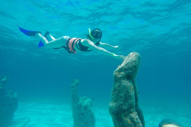 Cancun Half-Day Sailing Catamaran Cruise to Isla Mujeres - Sailing across Cancun’s clear water