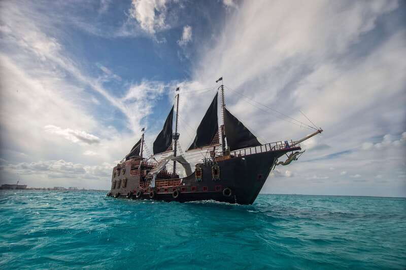 Cancún: Jolly Roger Pirate Dinner Cruise 2025 - A pirate show begins at Punta Sam