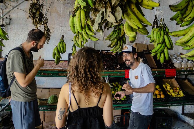 Cancun Walking Food Tour: Local Food, Markets, and Street Art. - Fruit, plants, and a pause for freshness
