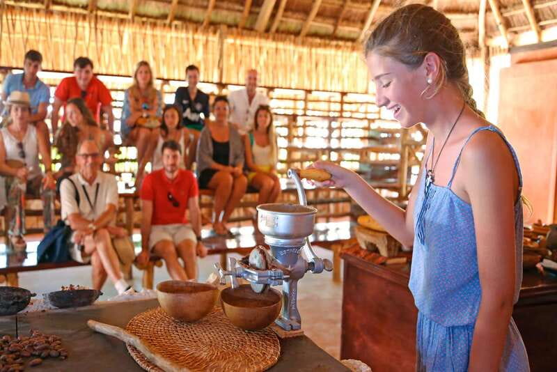 Cozumel: Chocolate Workshop at The Mayan Cacao Company - Grinding cacao on the traditional metate
