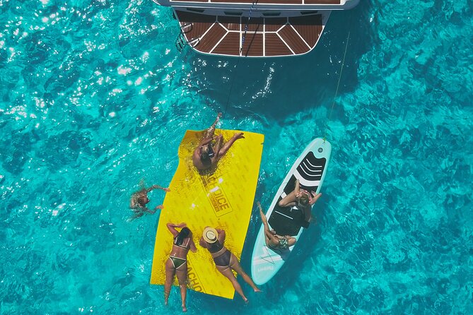 Deluxe Yacht 48FT with FlyBrige Rental in Cancun - Snorkeling, paddleboarding, and swimming time