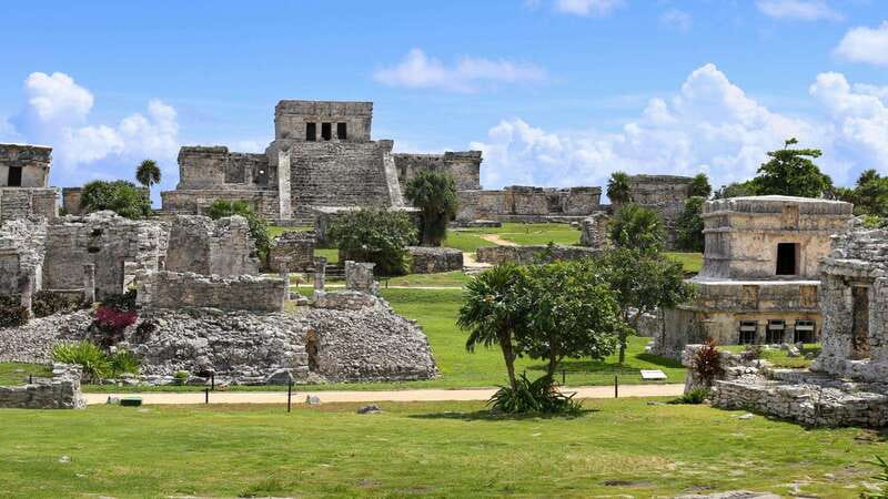 From Tulum: Tulum Ruins and 2 Cenotes Tour - Walking through Tulum’s Maya site