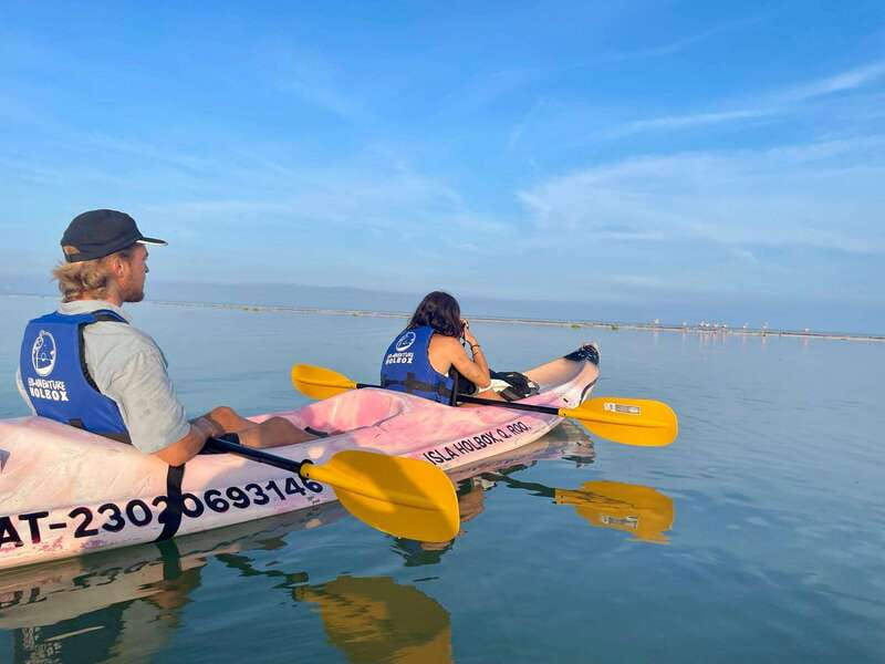 Holbox: Sunrise & Mangrove Kayak Tour - The fruit stop inside the river