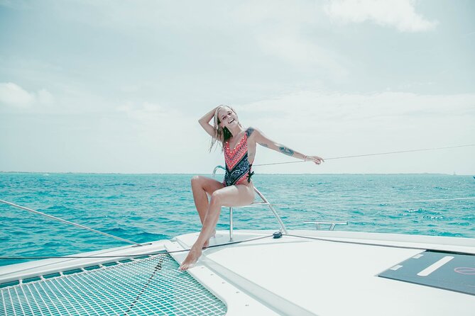 Isla Mujeres Cruise with Beach Club, Snorkel, Lunch and Open Bar - The catamaran ride: space, music, and a social mood