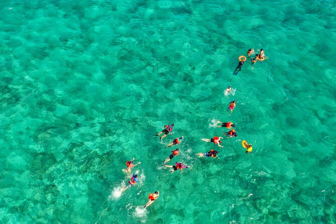 Isla Mujeres Island and Snorkeling Tour - Music, dancing, and the return ride