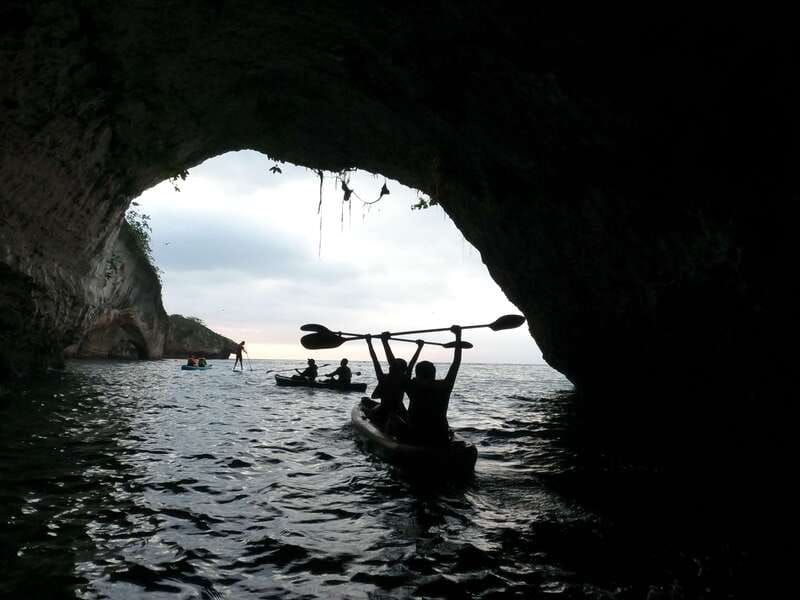 Mismaloya: Los Arcos Bioluminescent Waters Kayak & Cave Tour - Paddling toward Los Arcos National Marine Park