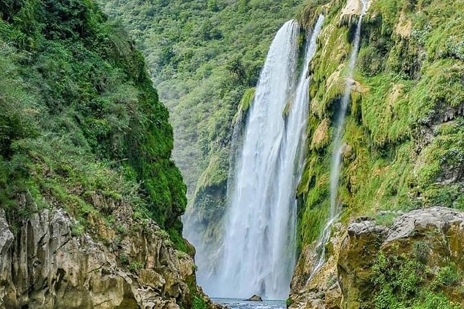 Tamul waterfall and water cave on a wooden canoe - Swimming at Cueva del Agua