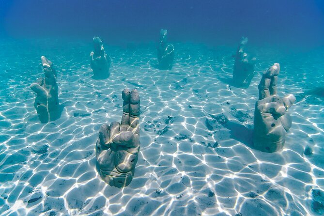 Top Isla Mujeres Catamaran Tour with Snorkel Open Bar and Buffet lunch - What the price really includes