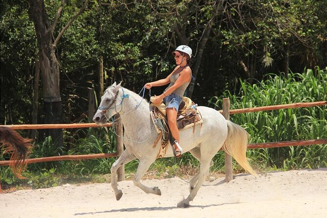 Tulum Jungle Horseback Ride + ATV + Ziplines + Cenote Combo Tour - Swimming through the underground cenote